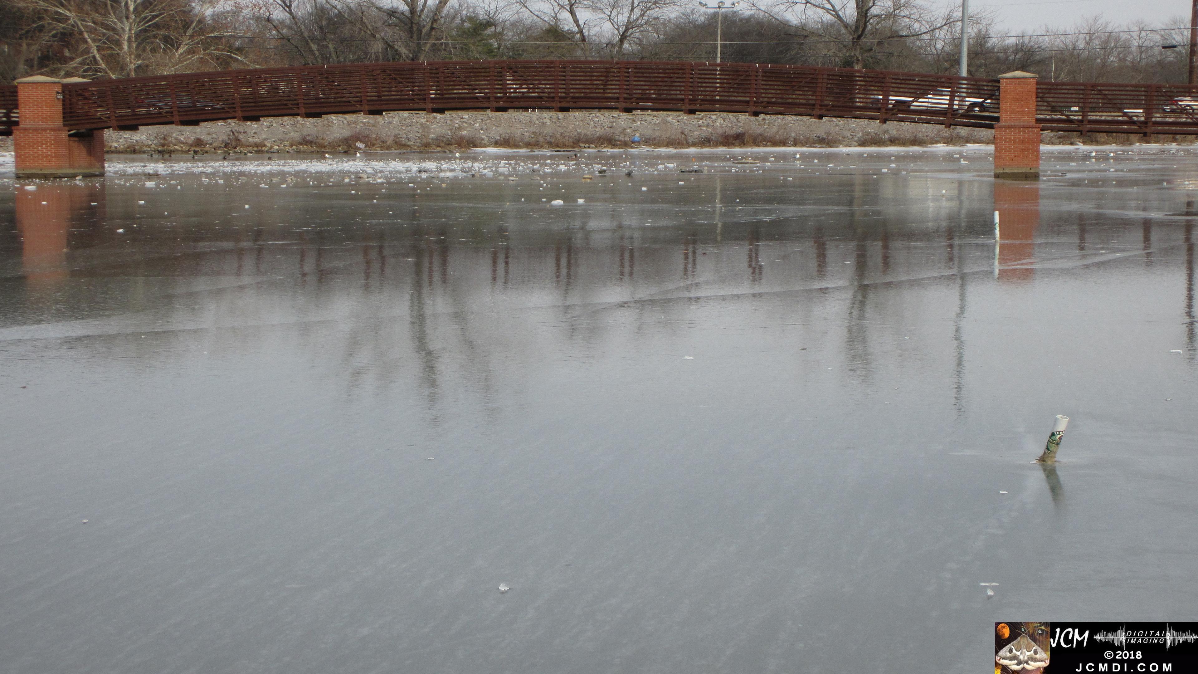 Frozen Lake in Tennessee with cracked clear ice